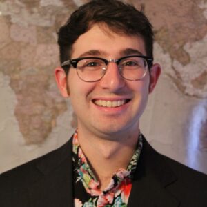 John Hatzis (He/Him)